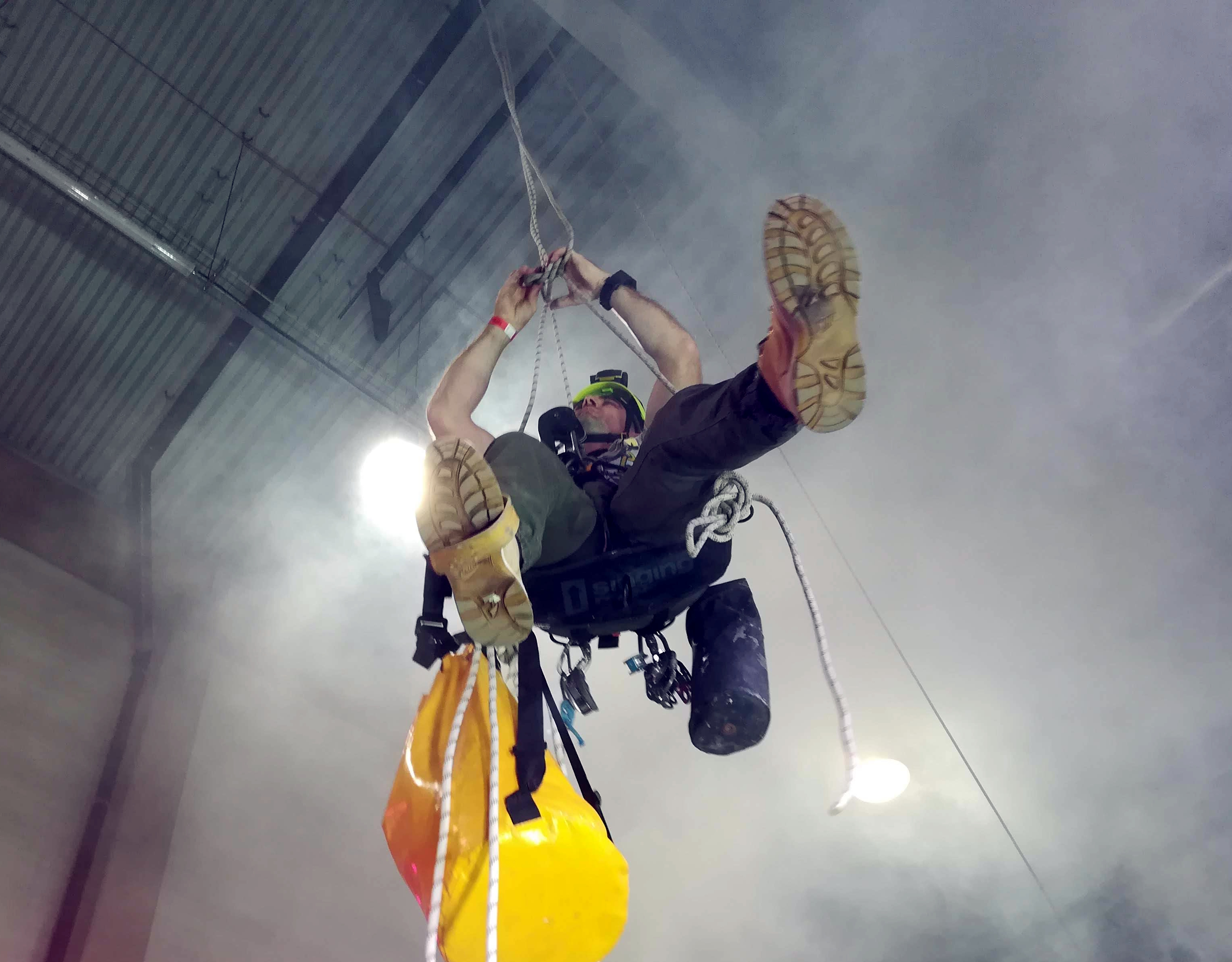 Rope access technician working on a high-rise building in Toronto